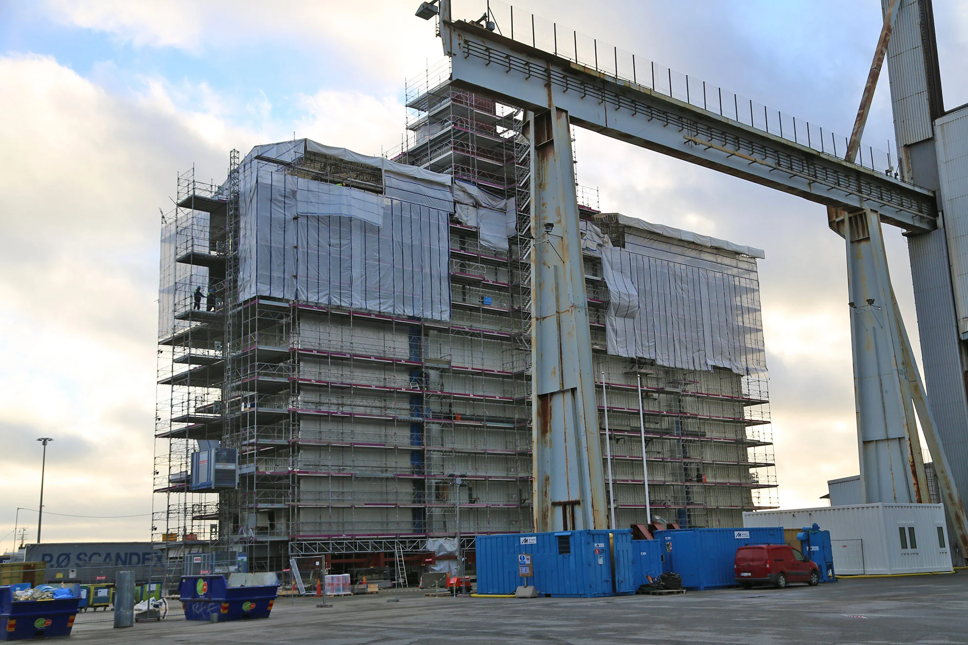 Oil infrastructure construction site with scaffolding and modular building