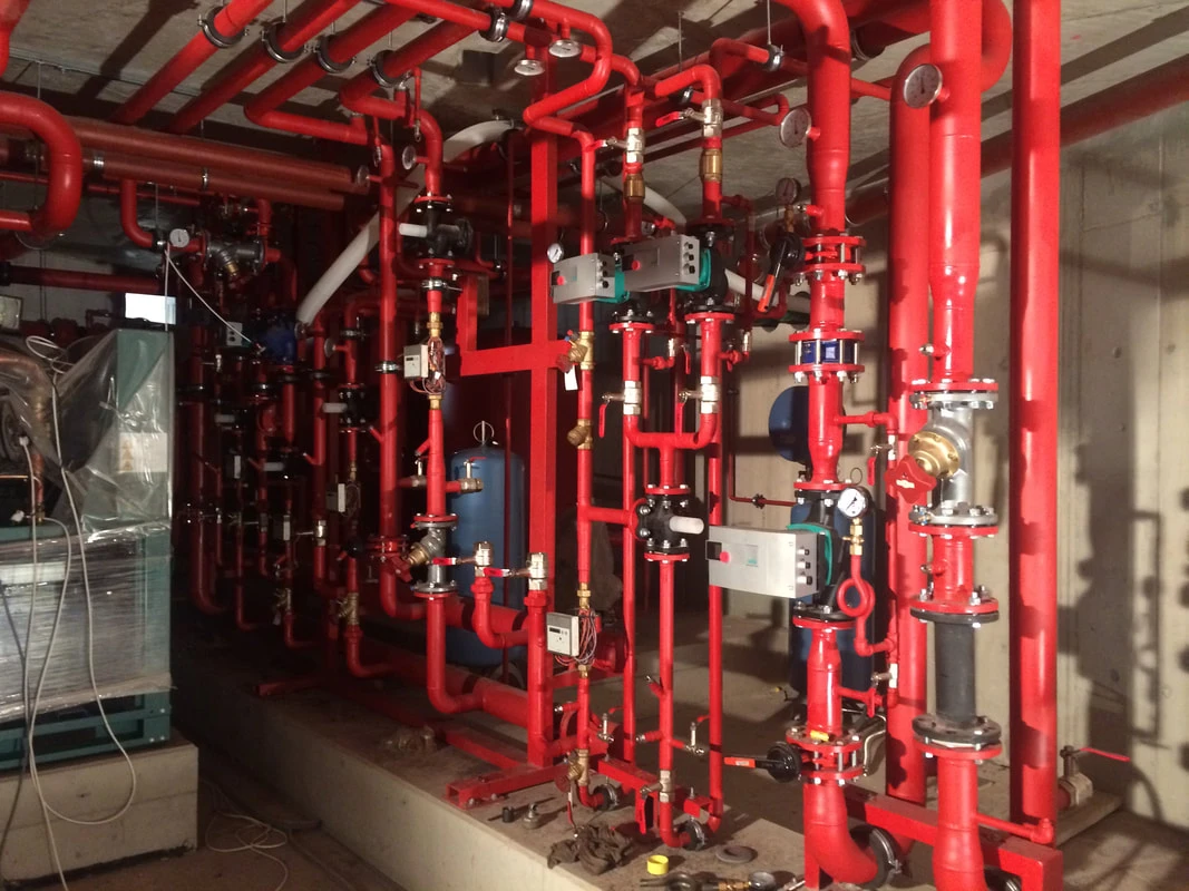 Installed red fire suppression piping system with valves and controls